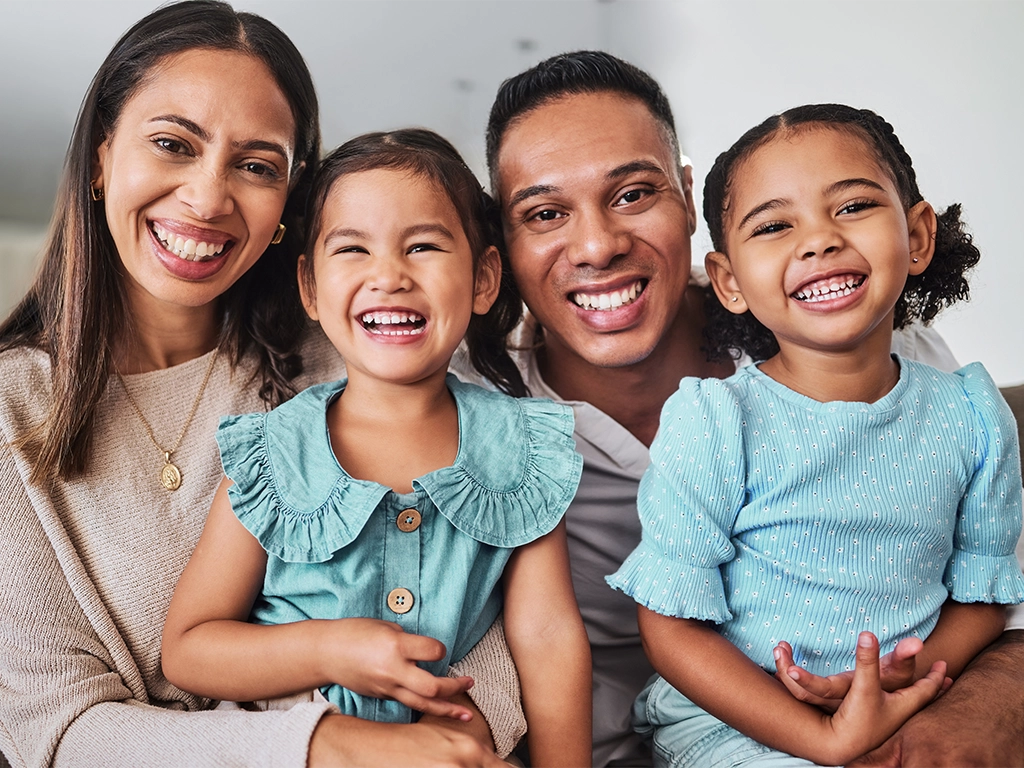 Happy family smiling, promoting affordable dental membership plan in Hickory Creek, TX